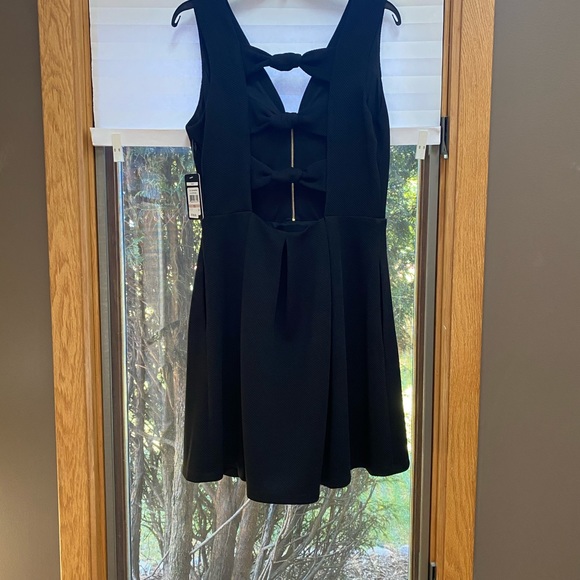 A “Must Have” Black Mini-Dress by Guess - Picture 2 of 6